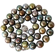 10.1-10.8MM Natural Tahitian Multi color pearls necklace. Prime Luster & Excellent Saturation 41 pearls Strung with ball clasp. 14Kt white gold. 18 inches Grand Total 64 grams Appraisal will accompany for: $12,000 Button Pearl Earrings, Multicolor Pearl Necklace, Edwardian Necklace, South Sea Pearl Necklace, Multicolor Necklace, South Sea Pearls Earrings, Customised Bracelets, Tahitian Pearl Necklace, Natural Pearl Necklace