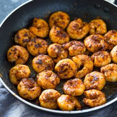 some fried food in a frying pan on a table