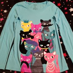 Nwot Light Blue Long Sleeved T-Shirt With Cats. Size L 10-12. Bundle And Save! Blue T-shirt With Character Print For Spring, Blue Cotton Top With Cartoon Print, Blue Crew Neck Tops With Character Print, Blue Cartoon Print Shirt For Spring, Blue Long Sleeve Shirt With Cartoon Print, Cute Blue Tops With Graphic Print, Blue Cartoon Print Long Sleeve Shirt, Cute Long Sleeve Blue Tops, Fun Blue Crew Neck Top