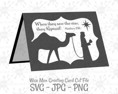 a black and white christmas card with a camel on it, saying when they saw the star