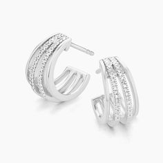 SKU# E-10651 Diamond Weight 0.10cts Earring Length 13.80 mm Width 8.80 mm Thickness 1.60 mm. Post back closure Finish 14k gold plated sterling silver or in sterling silver. Avoid contact with anything containing derivatives of alcohol. Diamond Stud Earrings, Huggie Earrings, Diamond Stud, Conflict Free Diamonds, Huggies Earrings, Diamond Earrings Studs, Gold Plated Sterling Silver, Diamond Studs, Wrap Around