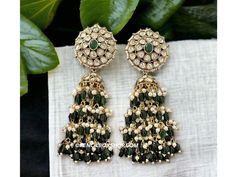 **Kundan Green Moissanite Jhumka Earrings - Elegant Bollywood Wedding Jewelry** Add a touch of timeless elegance to your jewelry collection with these exquisite Kundan Green Moissanite Jhumka Earrings. Perfect for weddings, Bollywood-inspired events, or any festive occasion, these earrings are a stunning example of traditional Indian craftsmanship. **Key Features - **High-Quality Materials Crafted with premium Kundan stones and green moissanite, these earrings offer a radiant sparkle that rivals Green Chandbalis For Reception And Festivals, Green Chandbali Bridal Earrings With Latkans, Green Chandbali Danglers For Wedding, Elegant Green Jhumkas For Reception, Green Earrings For Reception And Festivals, Green Bollywood Jhumkas With Intricate Design, Green Kundan Chandbalis For Reception, Green Latkans Earrings For Reception, Green Earrings For Wedding And Diwali