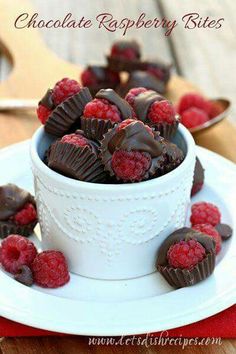 chocolate raspberries in a white bowl on a plate