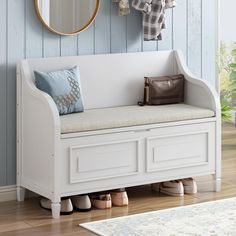 a white bench sitting in front of a mirror