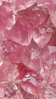 pink crystals are piled on top of each other