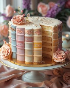 there is a cake with many layers and flowers on it