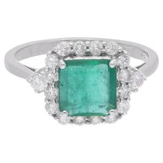 Immerse yourself in the enchanting beauty of this Zambian Emerald Gemstone Ring, an exquisite piece of handmade fine jewelry meticulously crafted in luxurious 18 Karat White Gold. Radiating elegance and sophistication, this ring is adorned with stunning diamonds, perfectly complementing the allure of the majestic emerald centerpiece. The ring is a size 7 US and may be resized to larger or smaller upon request. FOLLOW SPECTRUM JEWELS storefront to view the latest collection & exclusive pieces. Sp Handmade Fine Jewelry, Zambian Emerald, White Gold Jewelry, Emerald Gemstone, Zambia, Top Seller, Emerald Ring, Diamond Clarity, Cocktail Rings