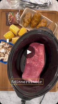 an image of corn on the cob and meat in crock pot with video