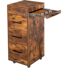 a wooden cabinet with three drawers on wheels and one drawer open to show the contents