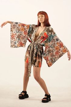 Japanese Style Patchwork Special Design Kimono with Ethnic Themes Includes Khaki and Terracotta colors Digital Printed Woven fabric Polyester This kimono comes in a standard size that fits XS to XL, ensuring a comfortable and versatile fit for various body types. The last image shows the exact colors of the product. Beige Floral Print Beach Kimono, Bohemian Beige Kimono For Festival, Hippie Multicolor Kimono With Kimono Sleeves, Multicolor Hippie Kimono With Kimono Sleeves, Beige Bohemian Wrap Kimono, Bohemian Multicolor Robe For Festivals, Patterned Open Front Kimono For Festival, Multicolor Printed Hippie Kimono, Bohemian Multicolor Printed Kimono