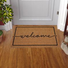 Welcome guests with a simple style, "Welcome" printed coir doormat. Coir fibers used to make this mat are extracted from Coconut husks, which are otherwise wasted. Each mat uses fiber from about 16 coconuts. The fiber is converted to yarn and then used to make these versatile doormats. After making the plain mat, the design is hand-stenciled by craftsmen, one layer at a time. The naturally resilient Coir mat scrapes mud, sand, water and dirt off shoes and the vinyl backing is slip resistant and durable. This is a highly functional doormat. Style Selections 1-1/2-ft x 2-1/2-ft Natural Coir/Vinyl Rectangular Indoor or Outdoor Decorative Door Mat in Black | WG-1830-CURSWEL Cute Door Mat, Last Name Door Mat, Hand Painted Door Mats, Front Door Mat Ideas, Front Door Matt, Fromt Doors, Door Mats Outdoor, Cute Door Mats, Doormat Ideas