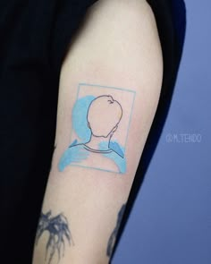 a person with a tattoo on their arm