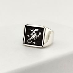 The ring is made of 925 sterling silver decorated with scorpion and star shapes. PRODUCT FEATURES -Products are shipped with free shipping along with the box and bag. - Production Mine: 925 Sterling Silver - Weight: 11,5 grams -Ring Diameter: 18x18 mm ✔ The motif, shape, symbol, letter and text you want can be written on the ring. Just specify in the request field. ✔ Ready to Ship in 1-3 Business Days ✔ Shipped to the worldwide 1-3 business days with free express shipping. ✔ The product will be Scorpio Ring, Scorpio Jewelry, Ring For Girlfriend, Scorpio Gifts, Zodiac Rings, Scorpio Zodiac, Astrology Zodiac, Ring Silver, Star Shape