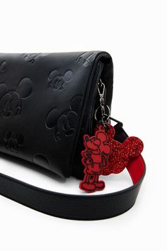 A midsize crossbody bag with a flap and multiple compartments and pockets. Featuring leather-effect fabric embossed with Disney's Mickey Mouse. Very soft leather-effect fabric with tone-on-tone silhouettes of Disney's Mickey Mouse Multiple inside and outside pockets Magnetic flap and zip closure on one side Two compartments Two straps Short handle for using as a clutch Long, adjustable, detachable strap for carrying across the body Keyring with contrasting Disney's Mickey Mouse charms 27.5 x 6 x Disney Bags Backpacks, Disney Trip Outfits, Mickey Mouse Bag, Disney Bag, Crossbody Bag Women, Pretty Bags, Original Clothes, Original Bags, Disney Outfits