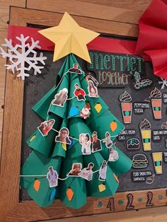 a paper christmas tree with pictures on it