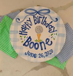 a happy birthday plate with a golf ball on it and the words happy birthday bone