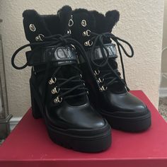 Valentino Black Combat Boot. Size 5. Fur Inside Boot. Never Worn. Luxury Round Toe Heels For Winter, Black Heels With Lug Sole For Winter, Black Winter Heels With Lug Sole, Designer Winter Ankle Boot Heels, Designer Ankle Boot Heels For Winter, Designer Black Boots With Lug Sole, Designer Black Boots With Buckle Closure, Black Calf Leather Heels For Winter, Winter Black Calf Leather Heels