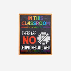 there are no cell phones allowed in this classroom poster on the wall with chalkboard