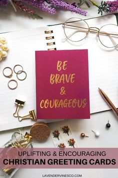 an open notebook with the words be brave and courageous on it next to other items