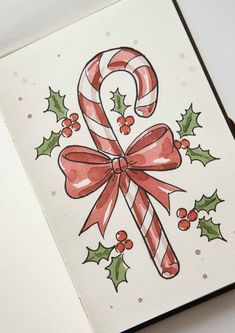 a christmas card with candy canes and holly