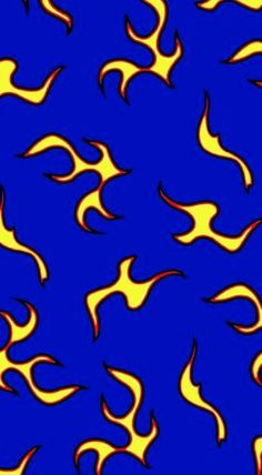 a blue background with yellow and red flames in the shape of fire on it's sides