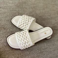 Designed With A Low Wedge Heel, These Sandals Are Comfortable And Ready For Relaxing Days And Dancing Into The Night. Flat Wedge Sandals With Woven Sole, Summer White Wedge Sandals With Adjustable Fit, White Adjustable Wedge Sandals For Summer, Summer White Adjustable Wedge Sandals, White Adjustable Summer Wedge Sandals, Flat Synthetic Wedge Sandals With Woven Sole, Adjustable White Wedge Sandals For Vacation, White Synthetic Sandals For The Beach, Elegant Beach Sandals With Woven Sole