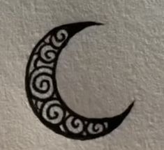 a black and white drawing of a crescent moon