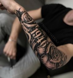 a man with a rose tattoo on his arm