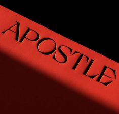 the word apostle is shown on a red book