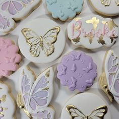 decorated cookies in pastel and gold with butterflies