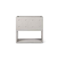 a white shelf with holes in it on a white background and the bottom section is made out of concrete