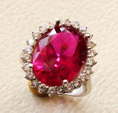 red corundum oval stone ring identical to genuine ruby classic cluster lady ring all sizes sterling silver 925 and white cubic zircon Risk free Quality guarantee policy : If you are not satisfied with your item for any reason simply send it to us and you will get a replacement or refund . please write or choose your size with the order and we will size it for you . Our ring is handcrafted mostly with a few simple tools . but some methods are used in casting like lost wax method . sterling silver Elegant Ruby Ring With Diamond Settings, Formal Oval Ruby Ring With Cubic Zirconia, Oval Ruby Ring With Cubic Zirconia For Formal Occasions, Oval Ruby Ring With Halo Setting In Cubic Zirconia, Oval Ruby Ring With Cubic Zirconia In Halo Setting, Formal Oval Ruby Ring With Stone Setting, Oval Stone Ring, Oval Stone, Cluster Ring