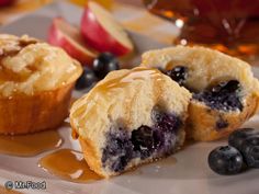 two blueberry muffins are sitting on a plate