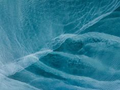 an ice cave with water flowing down the side