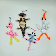 three beaded keychains in the shape of animals