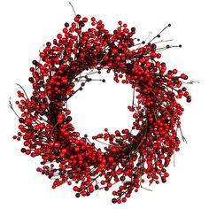 a wreath with red berries hanging from it's side on a white background,