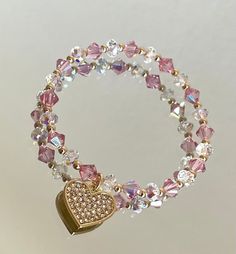 Made with 6mm pink high end crystals and 6mm clear ab swarovski crystal rondelle. Such a stunning piece for any occasion. Cheap Crystal Bracelet With Heart Beads For Women, Cheap Pink Chain Bracelet For Gift, Cheap Pink Crystal Bracelets, Cheap Crystal Heart Beads Bracelet As Gift, Cheap Pink Romantic Beaded Bracelets, Elegant Luxury Pink Beaded Bracelets, Pink Crystal Beaded Round Bracelets, Adjustable Pink Crystal Bracelet With Sparkling Stones, Pink Crystal Bracelet With Rhinestones