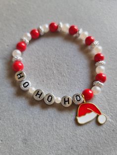 a red and white beaded bracelet with the word oh hoo written on it