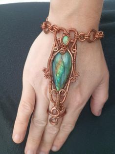 Copper wire wrapped dorsal surface bracelet/ring featuring labradorite and Ethiopian opal! Bracelet Ring, Wire Crafts, Chain Link Bracelet, Ethiopian Opal, Ring Bracelet, Copper Wire, Link Bracelets, Making Ideas, Chain Link