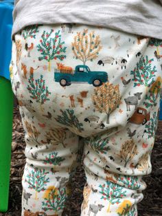 These Fall Farm Leggings are the perfect addition to your baby's wardrobe this season. Made with organic materials, these Harem Leggings are not only soft on your baby's skin but also cute and trendy. These baby joggers are designed with a Fall Farm theme, featuring adorable farm animals such as cows, horses, and sheep. These Fall Baby Pants are perfect for outdoor adventures and keeping your little one warm and cozy. These Organic Baby Pants are ideal for parents who value sustainability and na Cute Cotton Pants For Playwear, Spring Cotton Leggings For Playtime, Playful Cotton Leggings For Playtime, Playful Long Pants For Playtime, Cute Cotton Leggings For Loungewear, Playful White Cotton Leggings, Unisex Cotton Bottoms For Playtime, White Cotton Playtime Bottoms, White Cotton Bottoms For Playtime