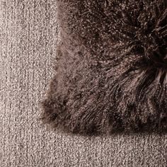 a close up view of a carpet with some fur on the top and bottom of it