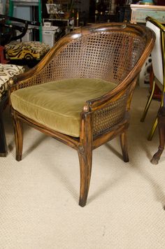 a wooden chair sitting on top of a carpeted floor