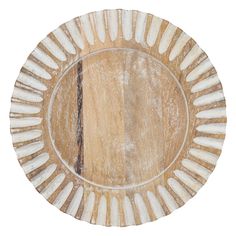 a wooden plate with white and brown designs on it