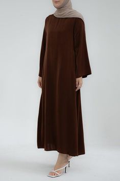 Yasmin Slip dress maxi length with a detachable belt and kimono sleeves in coffee - ANNAH HARIRI Elegant Long Sleeve Solid Color Kaftan, Elegant Belted Abaya, Modest Brown Maxi Dress, Elegant Brown Maxi Dress With Long Sleeves, Elegant Brown Long Sleeve Maxi Dress, Elegant Long Sleeve Brown Maxi Dress, Elegant Long Sleeve Brown Abaya, Elegant Solid Color Maxi Length Kaftan, Elegant Floor-length Solid Abaya