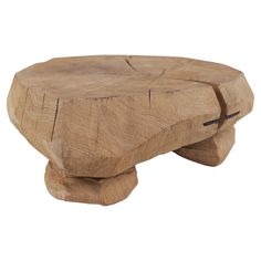 a wooden stool made out of wood with one foot resting on the top of it