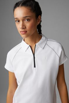 Elevate your sporty wardrobe with the Bogner Gail Polo, a sophisticated blend of functional elegance and contemporary style. Crafted with technical cotton and airy mesh sections, this polo shirt offers both breathability and chic comfort for any activity. Key Attributes: Superior Comfort: Made from piqué fabric, renowned for its texture and breathability, integrated with lightweight mesh sections for enhanced air circulation. This combination keeps you cool and comfortable, whether you're on the Poloshirt Design Ideas, White Polo Collar Sports Top, Classic Sports T-shirt With Polo Collar, White Sporty Polo Shirt With Branding, Sporty Polo Collar T-shirt With Moisture-wicking, Ice Logo, Polo Shirt Brands, Outside Activities, Sporty Polo Collar Golf T-shirt