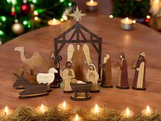 a nativity scene with candles on a table