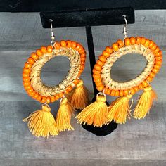 Round Orange Fringe Earrings With Fish Hook Yellow Tassel Earrings For Beach, Spring Beach Jewelry With Tassels, Dangle Earrings For Spring Vacation, Orange Tassel Jewelry For Summer, Spring Beach Dangle Earrings, Spring Vacation Dangle Earrings, Spring Beach Dangle Jewelry, Bohemian Dangle Hoop Earrings For Spring, Yellow Earrings For Spring Vacation