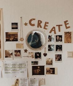 a white wall covered in photos and magnets with the word create written on it