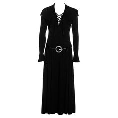 ▪ Gucci suede lace-up maxi dress and belt ▪ Designed by Tom Ford ▪ Deep v-neck with leather lace up fastening ▪ Large cape collar with natural edge ▪ Bishop sleeves with ruffled cuffs ▪ Gold 'GG' etched buttons ▪ Patent leather hip belt with large silver 'G' clasp ▪ IT 40 - FR 36 - UK 8 - US 4 ▪ Spring-Summer 1996 ▪ We believe this dress is a sample and never put into production making it a one-off. The runway version was produced in rayon and had a slightly different design. Gucci By Tom Ford, Ford Black, One Shoulder Gown, Eclectic Fashion, Suede Lace, Day Dress, Leather And Lace, Stylish Dresses, Tom Ford